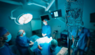 a-group-of-surgeons-in-a-hospital-operating-room.jpg a group of surgeons in a hospital operating room