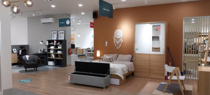 a-room-with-a-bed--desk--chair-and-shelves.jpg a room with a bed, desk, chair and shelves