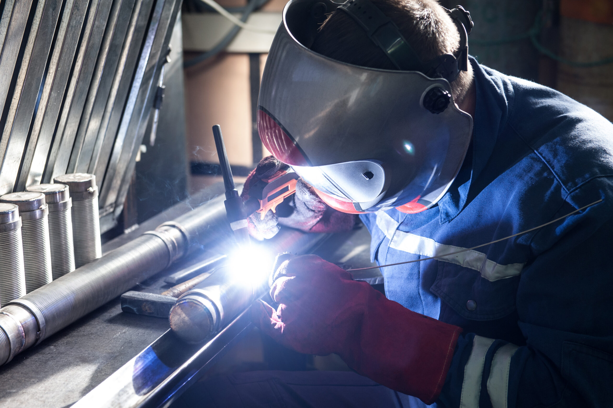 Closeup of man wearing mask welding in a workshop