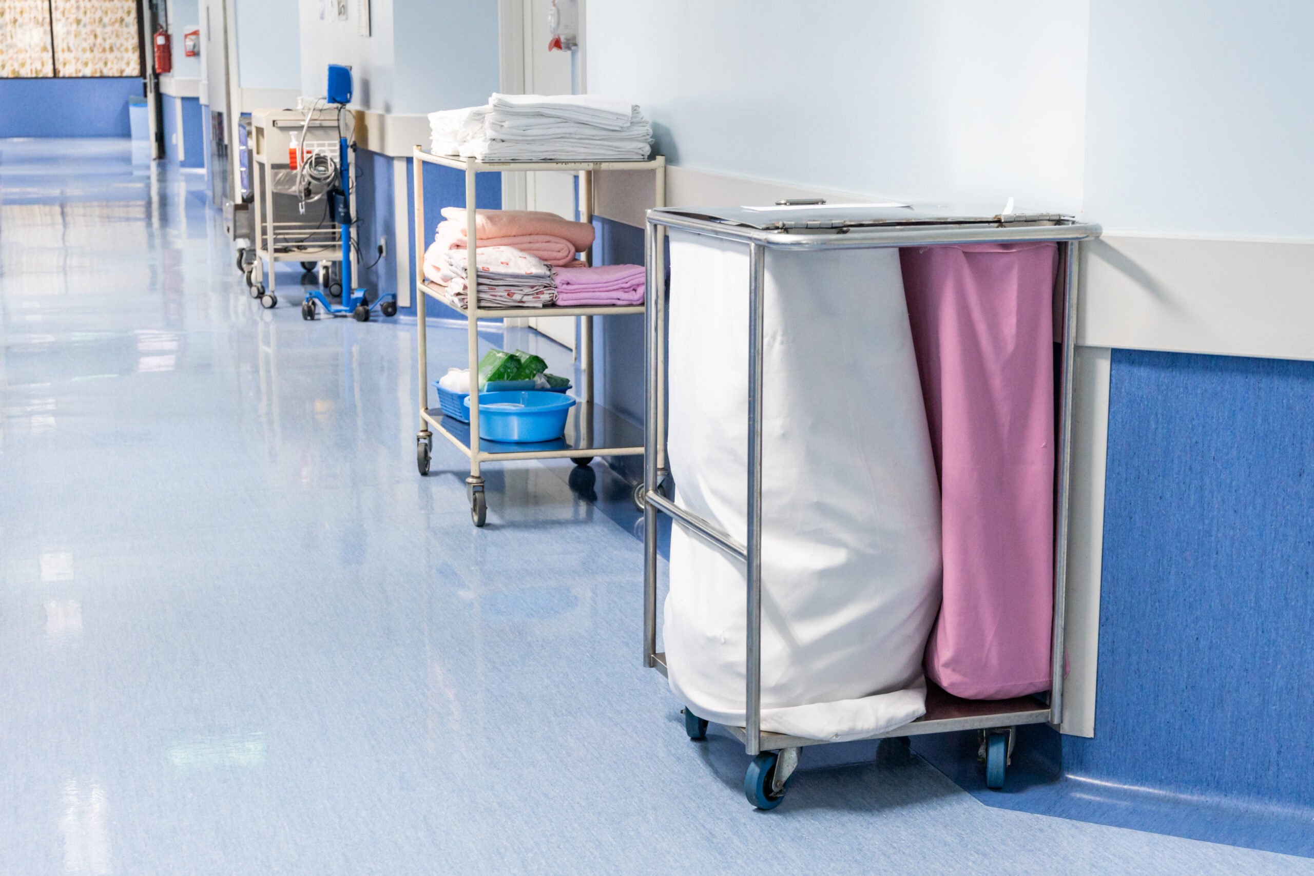 Laundry bags collect dirty used linen of patients at hospital ward for washing and disinfect.